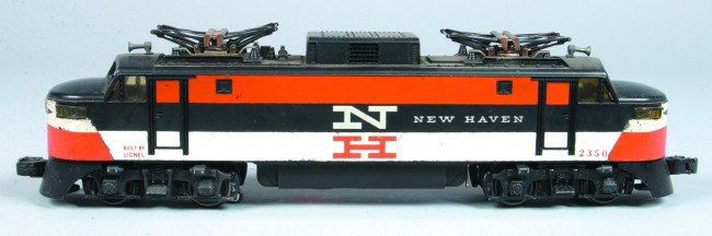 Lionel #2350 New Haven Electric Locomotive, (circa: Lionel #2350 New Haven Electric Locomotive, (circa 1956), overall good condition showing loss to orange and white striping, some tarnish to metal contacts at the top of locomotive. Locomotive has a ba