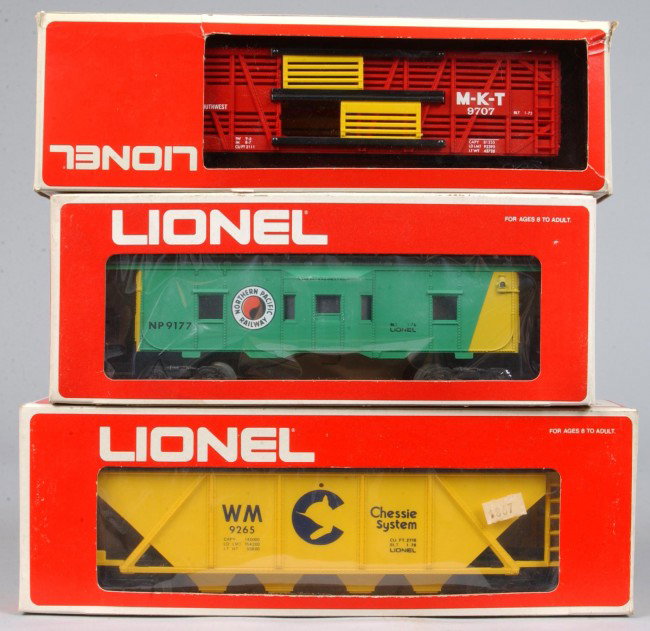 Lot of Three Lionel Train Cars, circa 1972-76, #6-: Lot of Three Lionel Train Cars, circa 1972-76, #6-9265 Hopper, #6-9177 Caboose, #6-9707 Stock car, overall good condition with wear on original boxes.