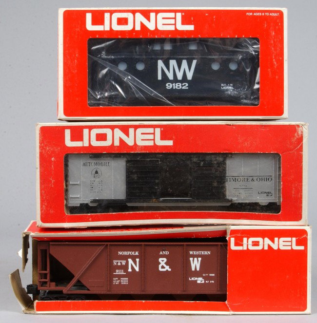 Three Lionel Train Cars, circa 1972-76, #6-9701 Au: Three Lionel Train Cars, circa 1972-76, #6-9701 Auto car, #6-9111 Hopper, #6-9182 Caboose, overall good condition in original box w/ hopper car box showing excessive wear.