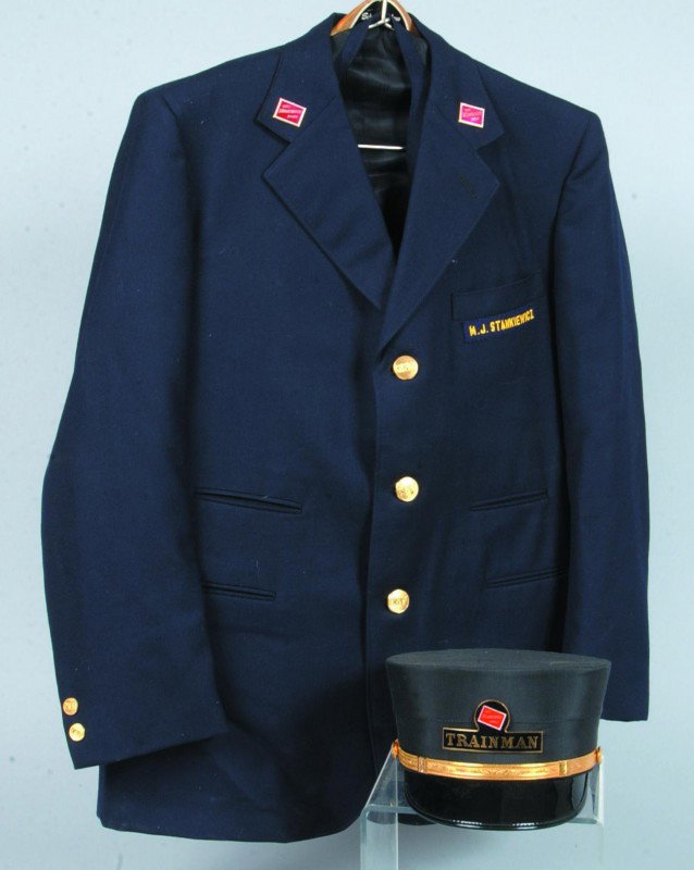 The Milwaukee Road Railroad Uniform, contains a si: The Milwaukee Road Railroad Uniform, contains a size 6-7/8" hat, a jacket, vest and two pair of pants. Jacket and vest hass brass embossed CMST-P logo buttons, hat has a brass name plate with two embo