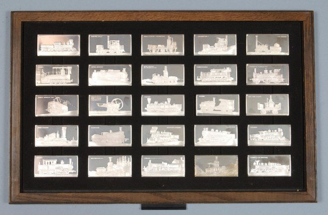 50 Sterling Silver Locomotive Ingots by the Frankl: 50 Sterling Silver Locomotive Ingots by the Franklin Mint, 45,000 grains,(102.8 ozs.) overall great condition in a wooden presentation box.