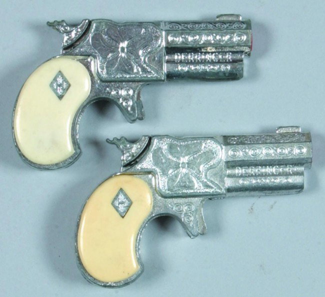 Two Derringer pistols, pot metal with plastic grip: Two Derringer pistols, pot metal with plastic grips, Mfg. Hubley, 3-1/4" long, condition: good