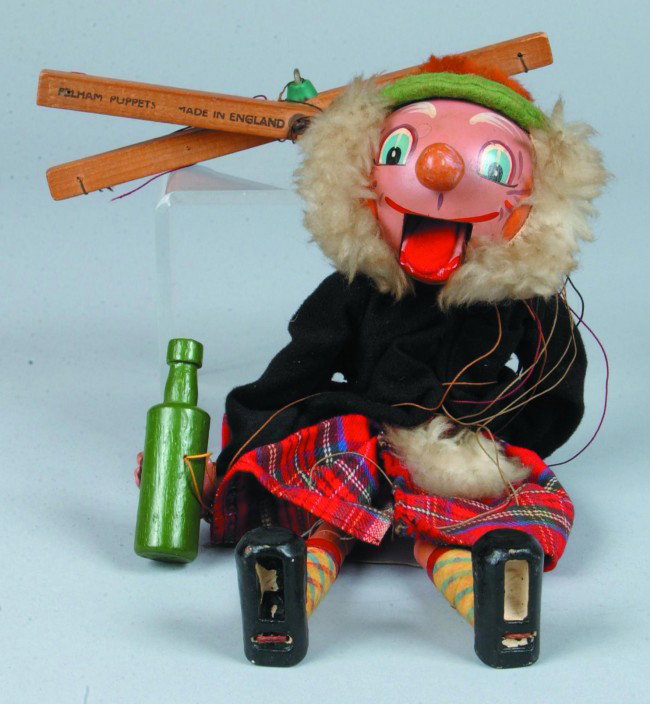 Marionette of Scotsman, wood, plastic and fabric P: Marionette of Scotsman, wood, plastic and fabric Pelman Puppets, made in England, 14" l., good.