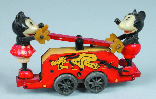 Mickey & Minnie Railroad Hand Car, wind-up, lithog: Mickey & Minnie Railroad Hand Car, wind-up, lithograph tin with celluloid and composition parts, 4-1/2" h. x 7-1/2" l., "Made in England", Nette-Wells, missing bell, good.