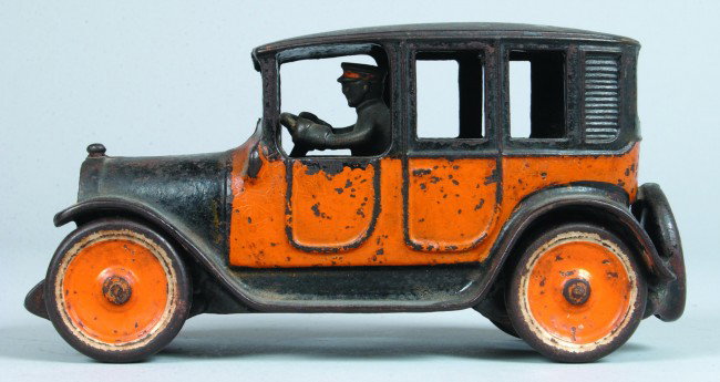 Taxi Sedan with Driver, painted cast iron, 1921-28: Taxi Sedan with Driver, painted cast iron, 1921-28, no "Yellow Cab" markings on doors, marked Arcade, made in USA, 9"l., complete, good with moderate wear.