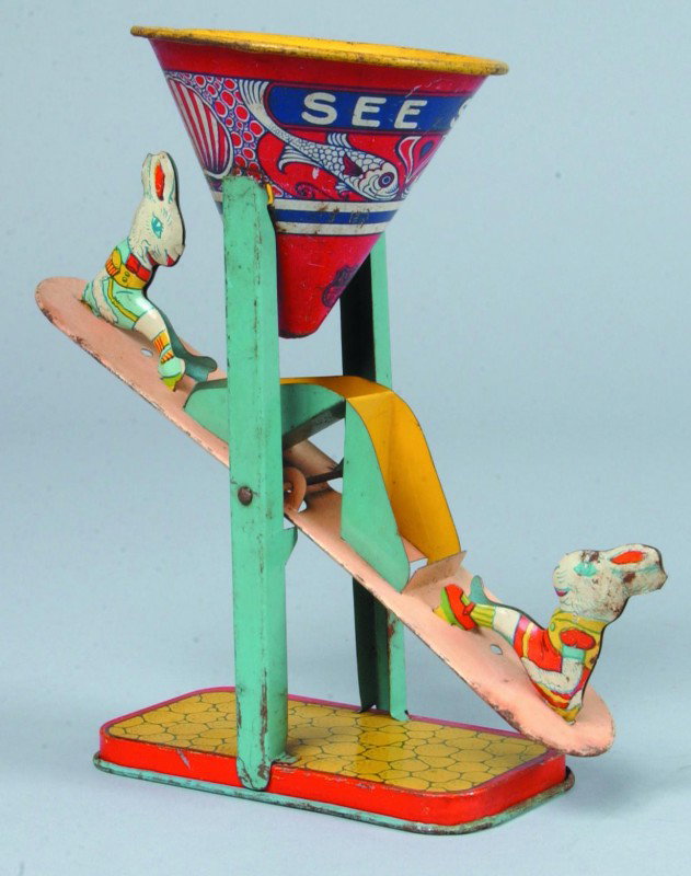 Sand Toy See-saw, lithograph tin, marked J. Chein : Sand Toy See-saw, lithograph tin, marked J. Chein & Co., USA, 7"h., good, light wear.