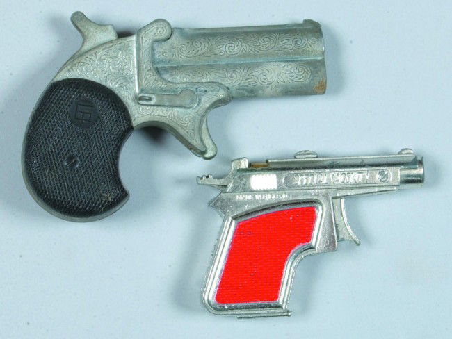 Two Derringer Style Cap Guns, one double barrel, p: Two Derringer Style Cap Guns, one double barrel, pot metal with plastic grips, made in Italy, 4" long, condition: fair, one Special Agent, pot metal with painted grips, made in England, condition: goo