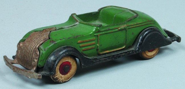 Dent Cast Iron Chrysler Airflow Fastback Roadster,: Dent Cast Iron Chrysler Airflow Fastback Roadster, circa. 1937, original green paint with nickel plated grill, black fenders and running boards, white rubber tires on red hubs, 6 1/2" long. Condition: