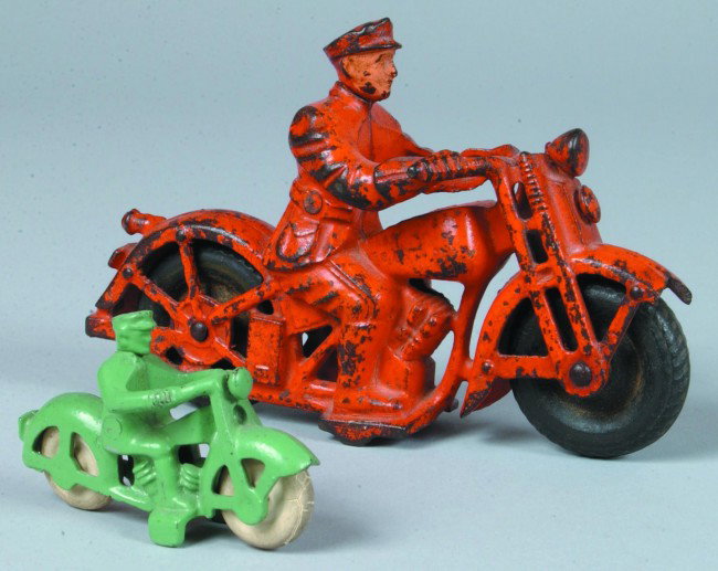 Two Hubley Cast Iron Patrol Motorcycles; First has: Two Hubley Cast Iron Patrol Motorcycles; First has orange paint and black tires, 6 1/2" long. Condition: front fender broken and paint loss, second has green paint and white tires, 3" long. Condition: