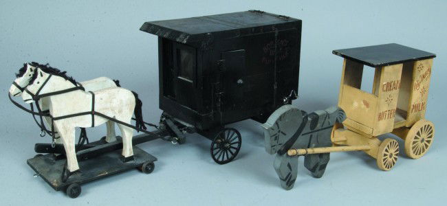 Two Various Home Made Horse Drawn Dairy Wagons; B: Two Various Home Made Horse Drawn Dairy Wagons; Borden's Dairy Pure Milk with two horse team, 19" long and City Dairy Milk, Cream and Butter with a single horse, 17 1/2" long. Condition: good.
