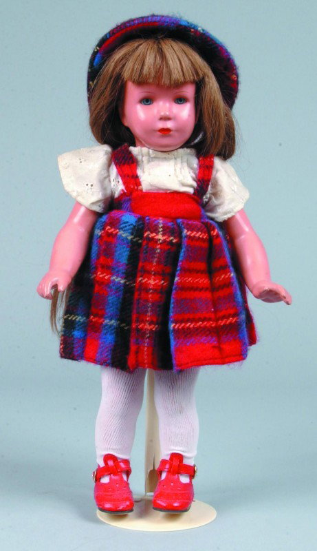 Celluloid Girl Doll with Turtle Mark, "T40", socke: Celluloid Girl Doll with Turtle Mark, "T40", socket head, blue glass eyes, closed mouth and light brown hair. 15" high. Condition: good.