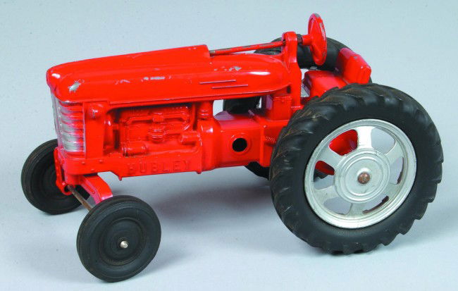 Hubley Kiddie Toy Die Cast Metal Tractor with orig: Hubley Kiddie Toy Die Cast Metal Tractor with original red paint, silver highlights and rubber tires with spoke wheels, missing loader. 9 1/4" long. Condition: Good with some paint loss and scratches.