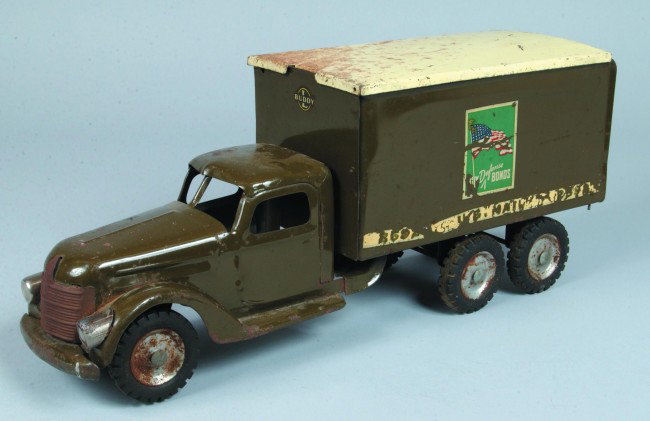 Buddy "L" Pressed Steel 2592 U.S. Mail Truck, oliv: Buddy "L" Pressed Steel 2592 U.S. Mail Truck, olive green body with cream removable roof, black rubber tires, side decals marked "Buy Defense Bonds", 22 1/2" long. Condition: Fair to good, shows surfa