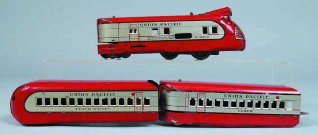 Marx M10000 Red and Silver Tin Lithograph Wind-up: Marx M10000 Red and Silver Tin Lithograph Wind-up Union Pacific Streamliner Three Piece Passenger Train Set with numerous track. Condition: good with normal scratches and wear.