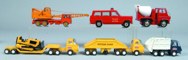 Lot of Six Pressed Steel and Cast Metal Vehicles i: Lot of Six Pressed Steel and Cast Metal Vehicles including Tonka; Sanitary truck, road grater and carrier with dozer, Marx cement mixer, Dinky Toy Crane truck and Cragstan Fire Dept. Jeep. 5 1/2" to 1
