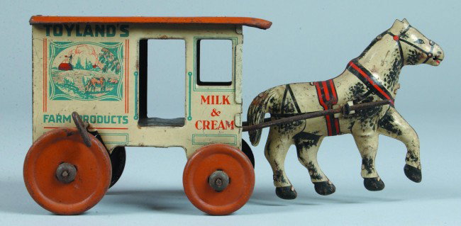 Marx Toyland Milk Wagon, tin lithograph wind-up, t: Marx Toyland Milk Wagon, tin lithograph wind-up, tan roof and tires with white horse . 4-1/2"h x 10-1/2"l. Condition: Good with minor scratches and scattered rust.