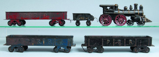 Harris Cast Iron and Steel Five Piece PRR Floor Tr: Harris Cast Iron and Steel Five Piece PRR Floor Train Freight Set. Painted cast iron locomotive with painted steel #735 tender and 3 PRR gondola cars. Locomotive measures 10" long. Condition: fair to 