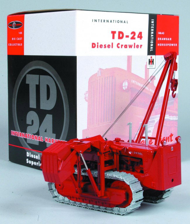 First Gear 1:24 Scale IH TD 24 Crawler with pipe l: First Gear 1:24 Scale IH TD 24 Crawler with pipe layer, model features 225 individual parts, fully functional parts and steel segmented steel tracks, like-new condition in original box.