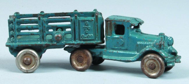 Coast to Coast Truck and Trailer, 5-1/2" l., blue: Coast to Coast Truck and Trailer, 5-1/2" l., blue painted cast iron, plated solid wheels, no makers mark attributed to AC Williams, light use, good.
