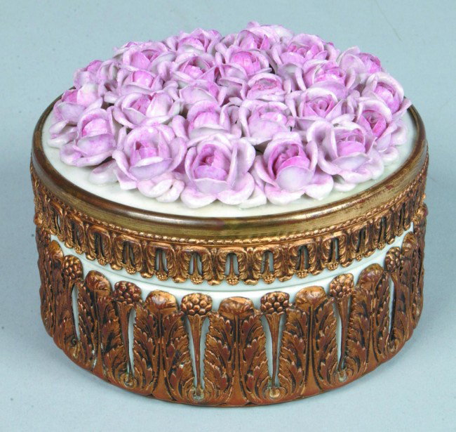German Porcelain Brass Ormolu Mounted Bureau Box, c: German Porcelain Brass Ormolu Mounted Bureau Box, cylindrical form with applied rose buds on lid and interior having a polychrome bouquet of flowers. Signed on bottom "Germany 5653". 3" high x 4 3/4"