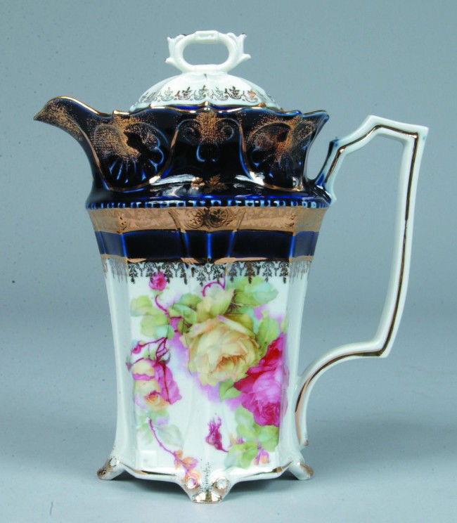 IPF, Germany Porcelain Chocolate Pot. Paneled form: IPF, Germany Porcelain Chocolate Pot. Paneled form with polychrome rose transfer with cobalt blue and gilt shoulder. 8 1/2" high. Condition: good.