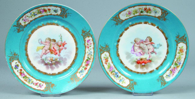 Two Hand Painted Plates attributed to Sevres Porce: Two Hand Painted Plates attributed to Sevres Porcelain, France. Central polychrome hand painted Cherub Scenes, blue border with triple medallions of floral sprays. Green oval mark "S.76.". 9" diameter