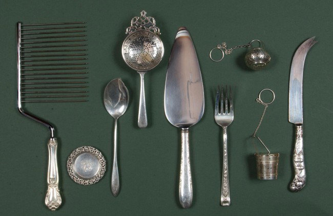 Eight Misc. Flatware pieces, including 2 tea balls: Eight Misc. Flatware pieces, including 2 tea balls w/tray; 1 tea strainer; service spoon and a fork, marked Sterling, various patterns: 4.5 oz troy total weight, also included cake server, cheese knif
