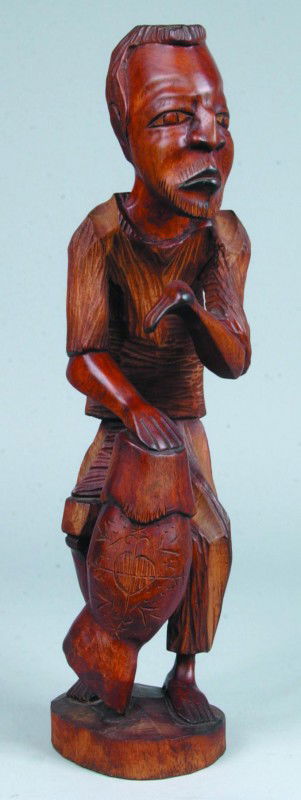 Teak Figural Carving, 22"h., man beating conga dru: Teak Figural Carving, 22"h., man beating conga drum with hands from Haiti, no markings. Condition good