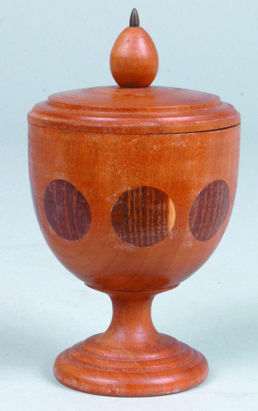 Jacob E. Brubaker Saffron Cup, 3.5"d. x 6"h., turn: Jacob E. Brubaker Saffron Cup, 3.5"d. x 6"h., turned lidded cherry cup with olive shaped finial, 8 moon phase osage orange medallions inlaid in side. Signed on bottom: "Apollo 17 Moon, Dec. 11 1972, J