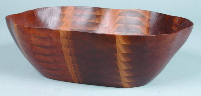David Zimmerman Handmade Bowl, 5"h. x 11"w. x 15"l: David Zimmerman Handmade Bowl, 5"h. x 11"w. x 15"l., layered and carved black walnut rectangular bowl, signed on bottom, "David Zimmerman, Lancaster, PA." Condition good