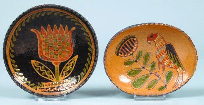 Two Greg Shooner Glazed Redware Pottery Small Plate: Two Greg Shooner Glazed Redware Pottery Small Plates; 2003 tulip and foliate slip decorated circular plate measures 6" diam. And 2004 oval plate/soap dish with sgrafitto bird and floral decoration mea