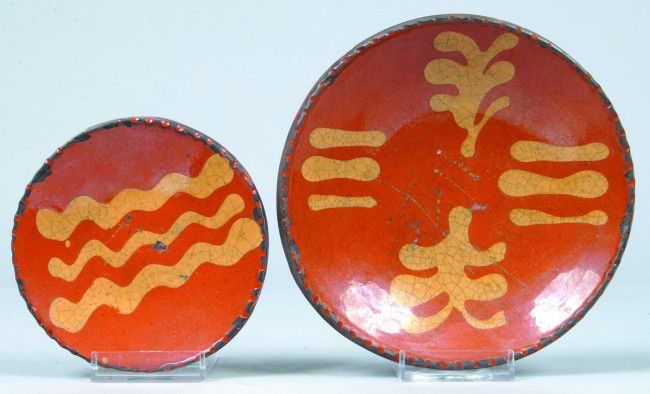 Two Greg Shooner Glazed Redware Pottery Small Plate: Two Greg Shooner Glazed Redware Pottery Small Plates with Yellow Slip Decoration and coggled wheel edges. 4 1/2" and 6 1/4" diameters. Condition: good with intentional wear.