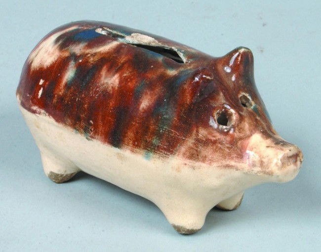 Earthenware Pig Coin Bank; mottled color glaze to t: Earthenware Pig Coin Bank; mottled color glaze to top half; 4 1/4" l.; Condition: small chips at coin slot.