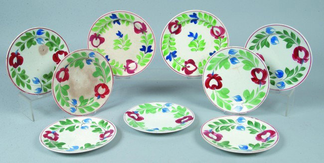 Nine Ironstone Late Adams Rose Plates; 7 plates 8 : Nine Ironstone Late Adams Rose Plates; 7 plates 8 3/4"d. and 2 plates 9 1/4"d.; Marked: "England" with Coat of Arms. Condition: 1 plate with crack, 1 plate with glaze pop and stain in center, o/w GOOD