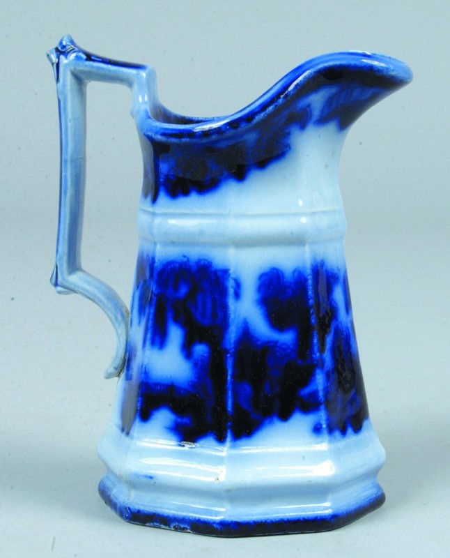 Flow Blue Ironstone Cream Pitcher, 5 3/4"h.; willo: Flow Blue Ironstone Cream Pitcher, 5 3/4"h.; willow pattern. No marks. Condition: Good