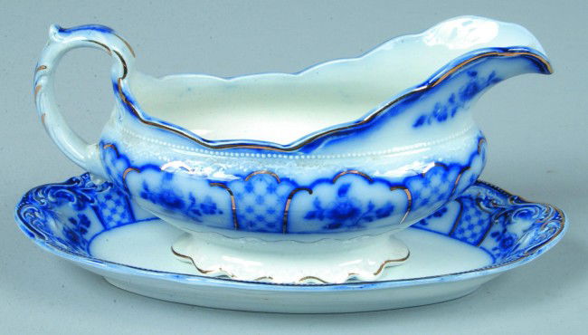 Flow Blue Ironstone Saucer Boat with Tray, 8"l. &: Flow Blue Ironstone Saucer Boat with Tray, 8"l. & 9"l.; Melborne design pattern with gold accents. Marked: W.H. Grindley & Co., England. Condition: Good