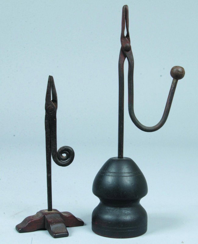 Two Wrought Iron Scissor Rush Lamps with wooden ba: Two Wrought Iron Scissor Rush Lamps with wooden bases. 7 1/2" and 11" high. Condition: good with normal wear.