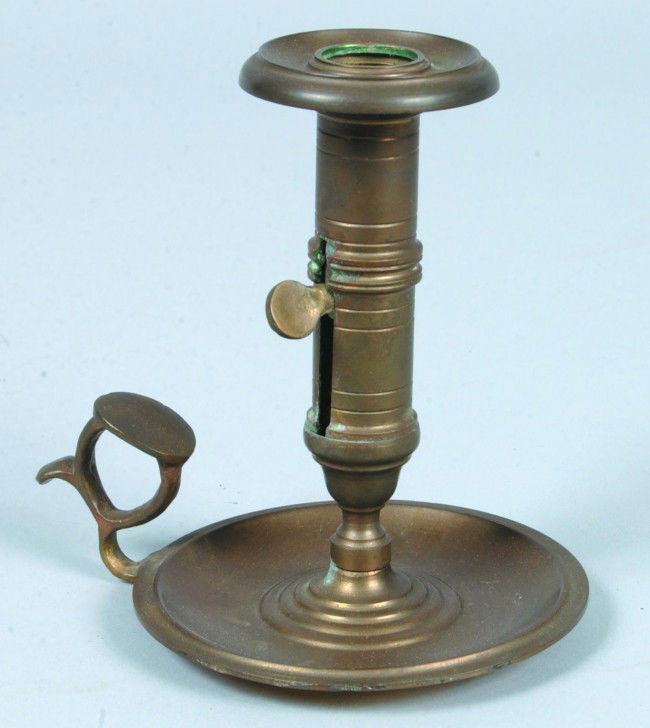 Brass Chamber Candlestick; cast brass push-up type: Brass Chamber Candlestick; cast brass push-up type socket, tray and finger ring. No mfg. marks. 5 1/2"h. Condition: GOOD