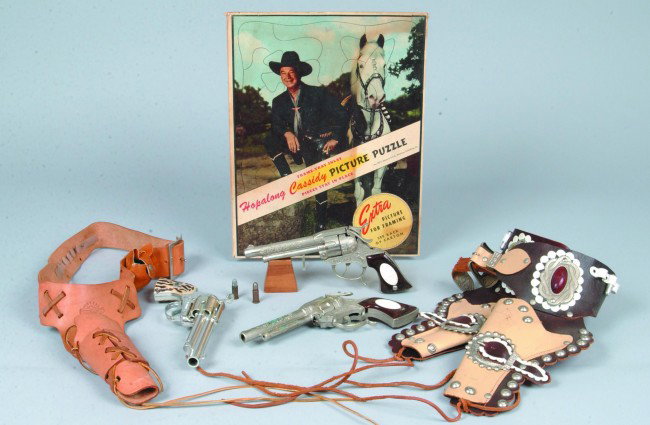 Cowboy Toys, including: cowhide single holster wit: Cowboy Toys, including: cowhide single holster with belt and "Fanner, Shootin' Shell" revolver, mfg. by Mattel with 15 bullets and extra slugs, GOOD condition; Double leather holster and belt with met