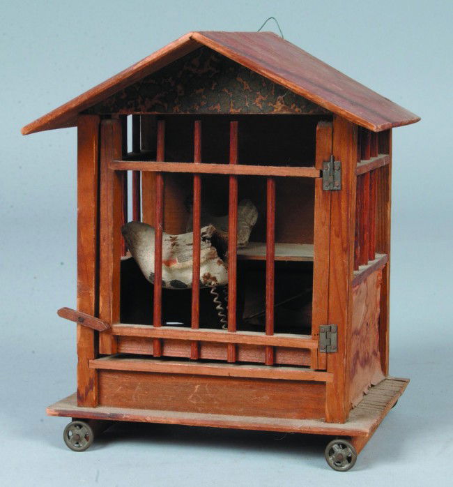 Chickens in Coop Squeek Pull Toy, 6 3/4"w. x 8 1/2: Chickens in Coop Squeek Pull Toy, 6 3/4"w. x 8 1/2"h.; plaster rooster and sitting hen on shelf, wood coop with printed roof, eave and sides with tin wheels. No makers marks. Condition: rooster missin
