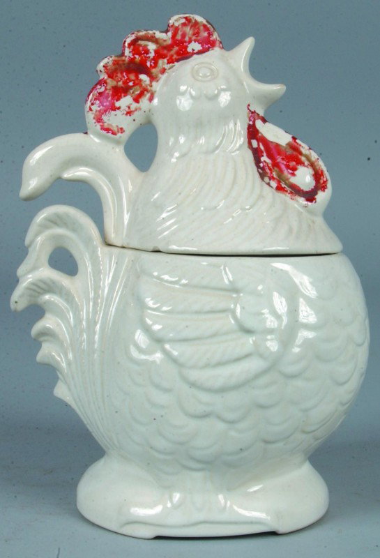 Crowing Rooster Cookie Jar, 11 1/2"h.; white ceram: Crowing Rooster Cookie Jar, 11 1/2"h.; white ceramic two part cookie jar, over-glaze painted mold features. No makers marks. Condition: paint loss, two chips underside of top half.