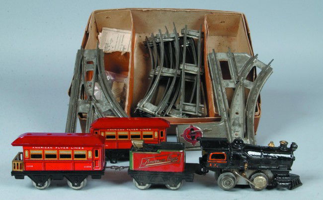 American Flyer Litho. Tinned Steel Train Set with: American Flyer Litho. Tinned Steel Train Set with Box; Key wound spring drive Engine with Tender and two cars, 14 pcs. of track all in Original labeled box. Marked: "American Flyer Wind-up Train". Con