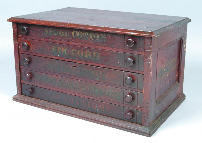 Willmantic Spool Thread Cabinet, 16"h. x 28"w. x 1: Willmantic Spool Thread Cabinet, 16"h. x 28"w. x 18 1/2"d.; stained oak case with five drawers. Labeling to drawer fronts. No makers marks. Condition: Good