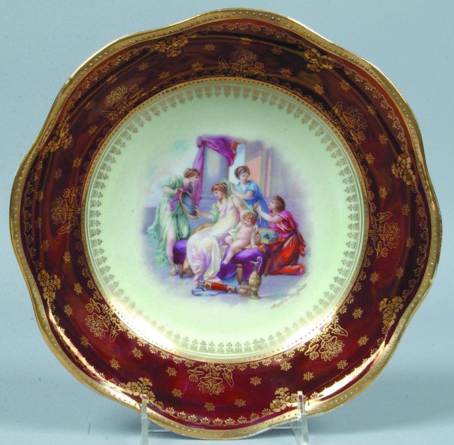RS Prussia/Royal Vienna Signed Bowl, 10"d.; Wide : RS Prussia/Royal Vienna Signed Bowl, 10"d.; Wide scalloped rim; Classic figural scene in center on cream ground surrounded by stenciled gold border and wide maroon band with stenciled flowers, borders