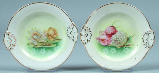 2 Child's Cake Plates, 4.75"d.; From a broken tea: 2 Child's Cake Plates, 4.75"d.; From a broken tea set of RS Prussia type, FD 33 and FD 38 in center of white body with gold highlights to mold features. No Marks. Condition: Good.
