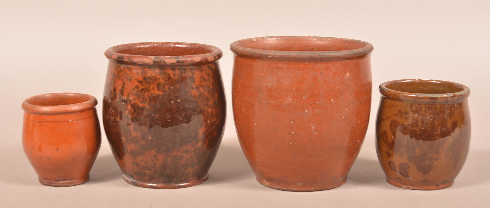 Four Pennsylvania Glazed Redware Storage Jars. (1 of 3)