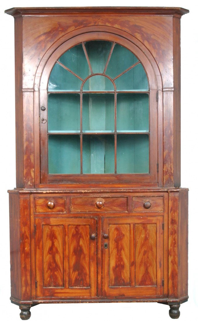 York County, Pennsylvania Grain Paint Decorated So: York County, Pennsylvania Grain Paint Decorated Softwood Two-Part Corner Cupboard attributed to John Rupp, Hanover, Pa. Bold grain painted decoration, stepped cornice with arched glazed single door ab