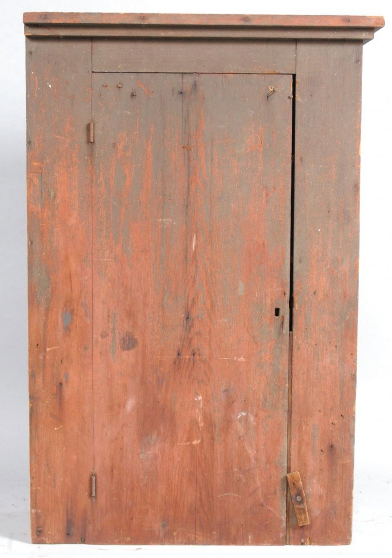Primitive 19th Century Softwood Hanging Chimney Cu: Primitive 19th Century Softwood Hanging Chimney Cupboard with remnances of brown paint over the original red surface. Molded cornice with single door and compartmented interior. Left side is unfinishe
