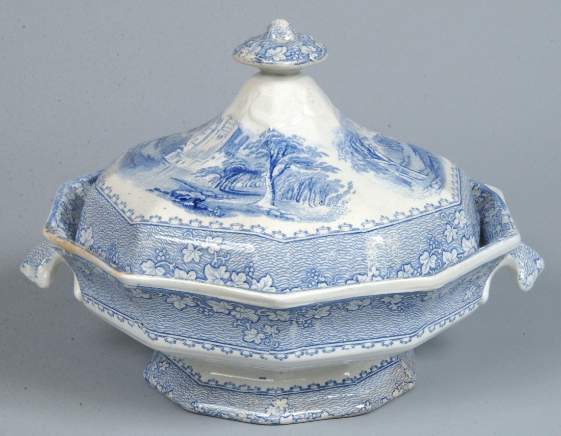 Ironstone China "Priory" Pattern Blue Transfer Cov: Ironstone China "Priory" Pattern Blue Transfer Covered Vegetable. Paneled and footed form with shell handles by John Alcock. 7 1/4"h x 10 1/2" diam. Condition: good with minor stains.