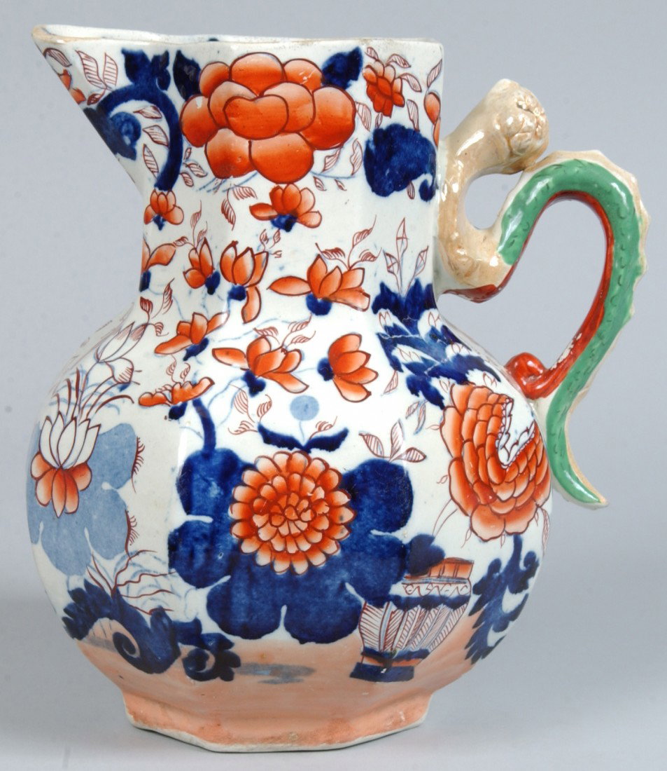 Ironstone China Gaudy Transfer Pitcher with floral: Ironstone China Gaudy Transfer Pitcher with floral and foliate design and serpent handle, by Davenport. 9 1/4" high. Condition: good.